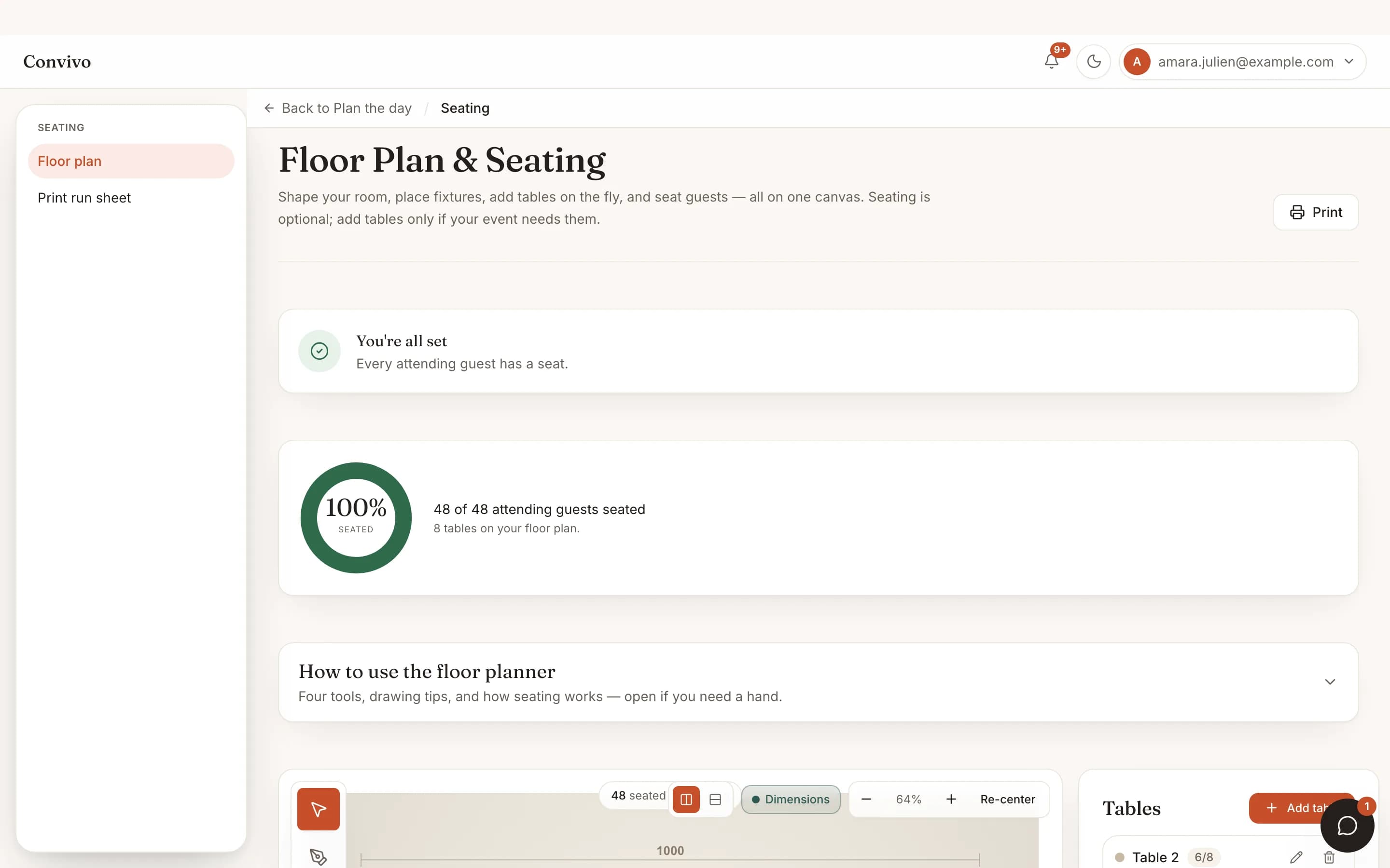 The seating floor plan with round tables and a 100% guests-seated summary.